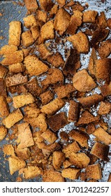 Burnt Bread Crackers. The Texture Of The Slices Of Dry Rye Bread. Crackers Or Rusks Made From Homemade White Bread Are Baked In The Oven In Close-up. Cooking Croutons.