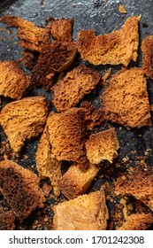 Burnt Bread Crackers. The Texture Of The Slices Of Dry Rye Bread. Crackers Or Rusks Made From Homemade White Bread Are Baked In The Oven In Close-up. Cooking Croutons.