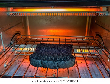 Burnt Bread On The Electric Oven Grill. Bread Toast Burned In The Electric Oven.