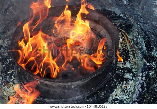 burnt car wheel, car accident, wheel in\
the fire, burnt tires, burning tires for\
protest