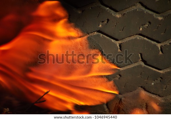 burnt car\
wheel, car accident, wheel in the fire, burnt tires, burning tires\
for protest. Hellfire. Hot flame\
fire