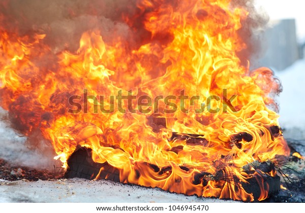 burnt car\
wheel, car accident, wheel in the fire, burnt tires, burning tires\
for protest. Hellfire. Hot flame\
fire
