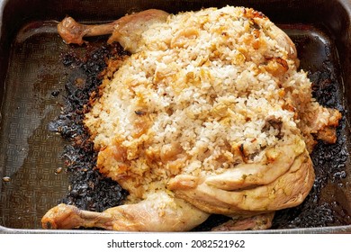 Burnt Chicken Stuffed With Rice On A Metal Pan