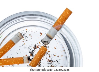 Burnt Cigarette Butts In An Ash Tray Isolated On White