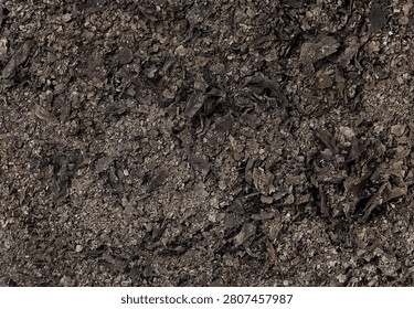 Burnt documents or cinder, top view. Texture of ash from burnt paper, as background.