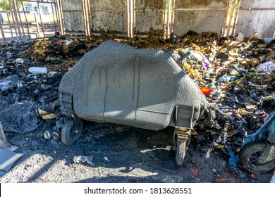 A Burnt Garbage Can, A Fire Site, A Dissolved Garbage Can