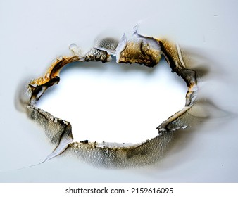 burnt hole in white plastic