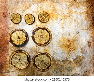 Burnt lemon slices on metal baking sheet drink garnish