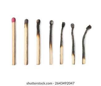 Burnt matches and whole one on white background
