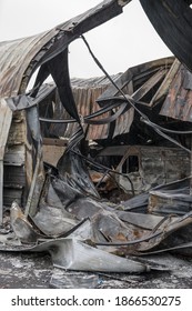 Burnt Out Auto Repair Shop With A Wrecked Car And A Lot Of Sheet Metal