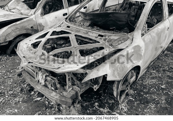 Burnt out body of\
car.Arson, short circuit