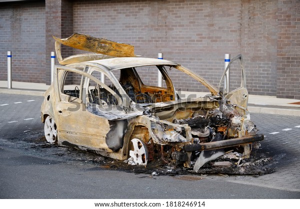 Burnt out car\
set of fire and left by joy\
rider