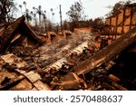 A burnt-down house stands in ruins, a stark reminder of the devastation caused by the Eaton Fire in Altadena, California.