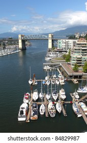 The Burrard bridge, False creek & urban surroundings Vancouver BC Canada.