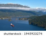 Burrard Inlet Oil Tanker at Anchor. An oil tanker anchored in Burrard Inlet. The Coast Mountains in the background. Vancouver, British Columbia, Canada.

                               