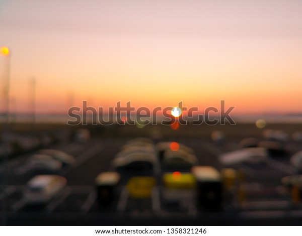burrbackground behind the mirror at the sunrise times on\
the morning , at the car park, the signal to start the day. bege\
background 