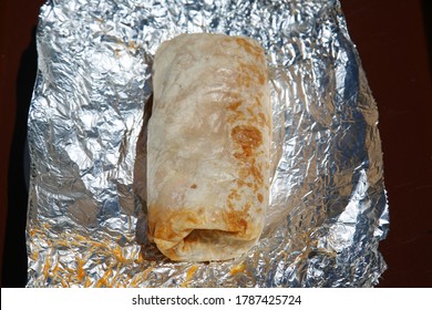 Burrito. Chicken Or Steak Burrito In A Foil Wrapper. Burrito With Chicken, Rice, Cheese, Salsa, Beans, Onions Grilled To Perfection. Lunch Or Dinner Menu. Burritos Are Enjoyed World Wide. 
