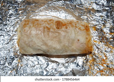 Burrito. Chicken Or Steak Burrito In A Foil Wrapper. Burrito With Chicken, Rice, Cheese, Salsa, Beans, Onions Grilled To Perfection. Lunch Or Dinner Menu. Burritos Are Enjoyed World Wide. 
