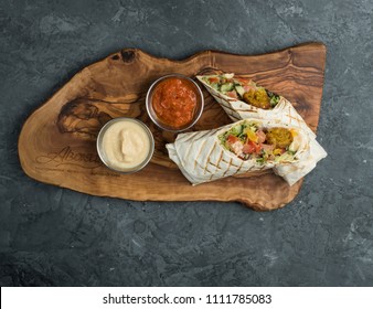 Burrito Vegetarian With Vegetables On The Desk Table