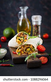 Burritos Wraps With Beef And Vegetables On  Black Background. Beef Burrito, Mexican Food.