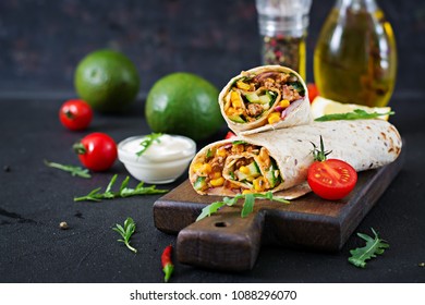 Burritos Wraps With Beef And Vegetables On  Black Background. Beef Burrito, Mexican Food.