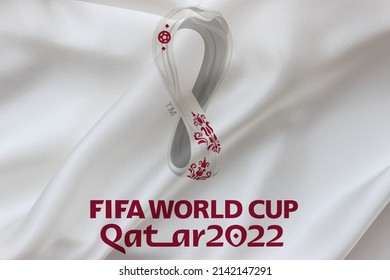 Bursa, Turkey - April 3, 2022: Qatar 2022 Fifa World Cup logo on white silk waving flag. International football organization in Qatar.