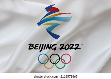 Bursa, Turkey - February 5, 2022: Beiing, China 2022 olympic games logo on silk wavy white background. Winter games flag design.