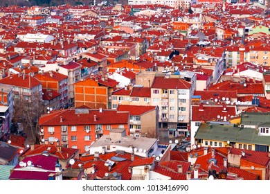 Bursa, Turkey - January 26, 2018: Aerial View Of Bursa City With Roof Tops Of Residential Buildings And Satelite Receiver Pollution.