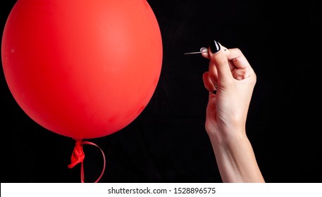 Burst Red Balloon With A Needle - Danger Concept