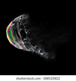 Burst Soap Bubble In Colorful Colors On Black Background