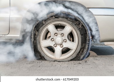 burst tire on the road - Shutterstock ID 617049203