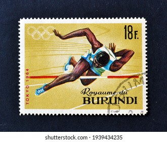 Burundi - Circa 1965 : Cancelled Postage Stamp Printed By Burundi, That Shows High Jump And Promotes Summer Olympic Games 1964 - Tokyo, Circa 1965.