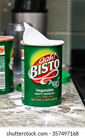 BURY ST EDMUNDS, UK - DECEMBER 25 2015: An Open Carton Of Bisto Instant Gravy Granules On A Messy Kitchen Worktop During Christmas Lunch Preparations.