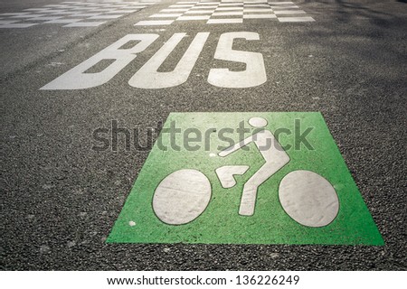 Bus and bicycle signs on the road surface, Paris, France