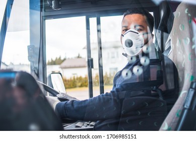 Bus Driver With Mask Puts Protecting Gloves On His Young Hispanic Hand In Bus To Protect Himself From The Coronavirus Epidemic. Covid 19. Protect From Corona Virus. Quarantine 2020. Stay Home.