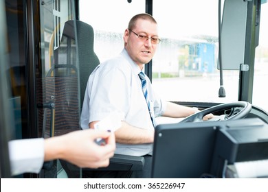 Bus Driver Selling Tickets In Bus From Drivers Seat