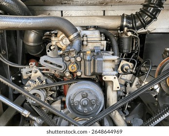Bus engine. Closeup on part of bus or car engine. Mechanic repairs vehicle in garage.