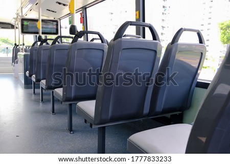 Bus interior: back view of seats on empty double decker bus. Blank advertising space; for mockup display; seat sticker wrap.
