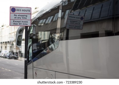 A Bus In London Parks In A Bus Stopping Zone On A Red Route Road