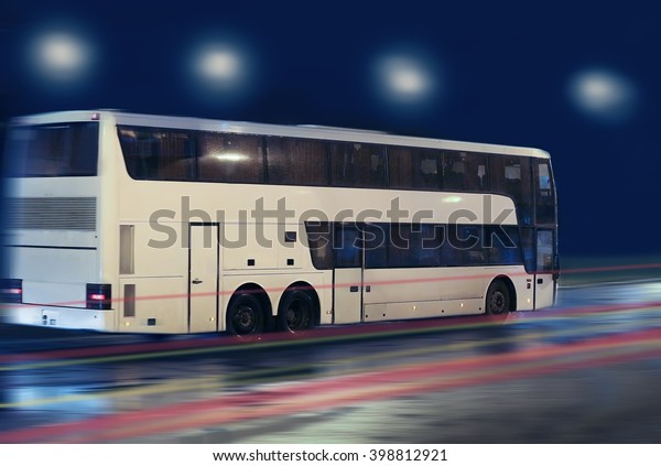 bus moving on the night\
city street