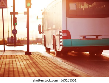 Bus moving on the road in city in early morning. View to the traffic with trafficlights and transport - Powered by Shutterstock