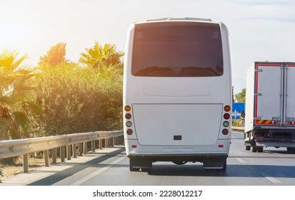 Bus on the city road in the left lane, rear view - Shutterstock ID 2228012217