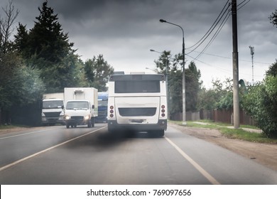 Bus On The Road With Black Diesel Exhaust