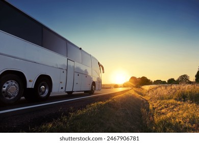 Bus on the road at sunset