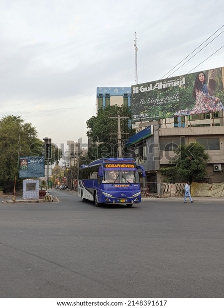 Bus, public transport, in
blue and gray colors. Commercial buildings. Multan, Pakistan. 04.
10. 2022.