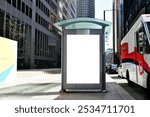 bus shelter with blank ad panel. billboard display. empty white lightbox sign at bus stop. billboard mockup. glass structure. city transit station. North American urban street. outdoor advertising.