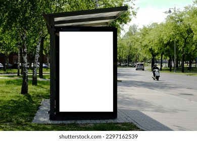 bus shelter at busstop. blank white lightbox. empty billboard. bus shelter ad. glass and aluminum structure. transit station. urban setting. city street background. stone sidewalk. base for mockup - Shutterstock ID 2297162539