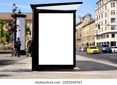 bus shelter at busstop. transit station. blank white billboard ad sign and lightbox. bus shelter advertising. soft background. glass and aluminum structure. white poster ad commercial poster display