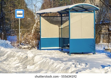 Bus Shelter Near Snow Covered Road In Winter