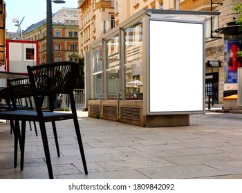 Bus Shelter And Bus Stop Along Urban Street. Glass And Aluminum Structure. City Street With Trees. Blank Area For Poster And Ad Display. Light Box. Banner And Copy Space. Selective Focus. Mockup Base